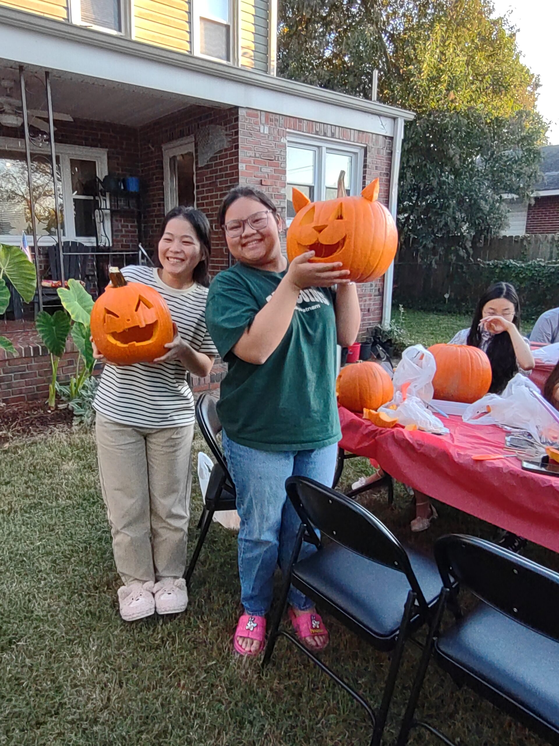 A student standing in front of her science project at the science fair.